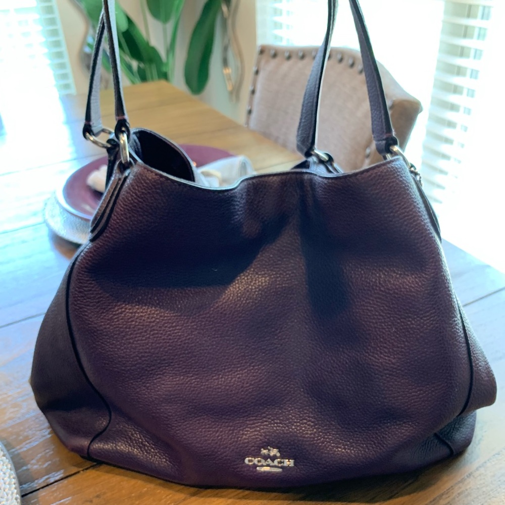 Purple coach leather purse in good condition.